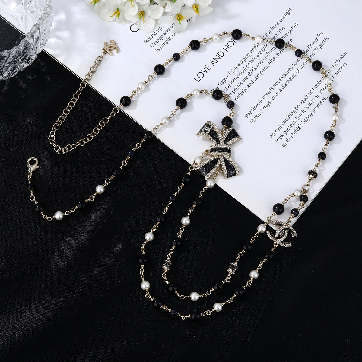 CHANEL 25S CHAIN BELT IN BLACK AND WHITE PEARL 614285